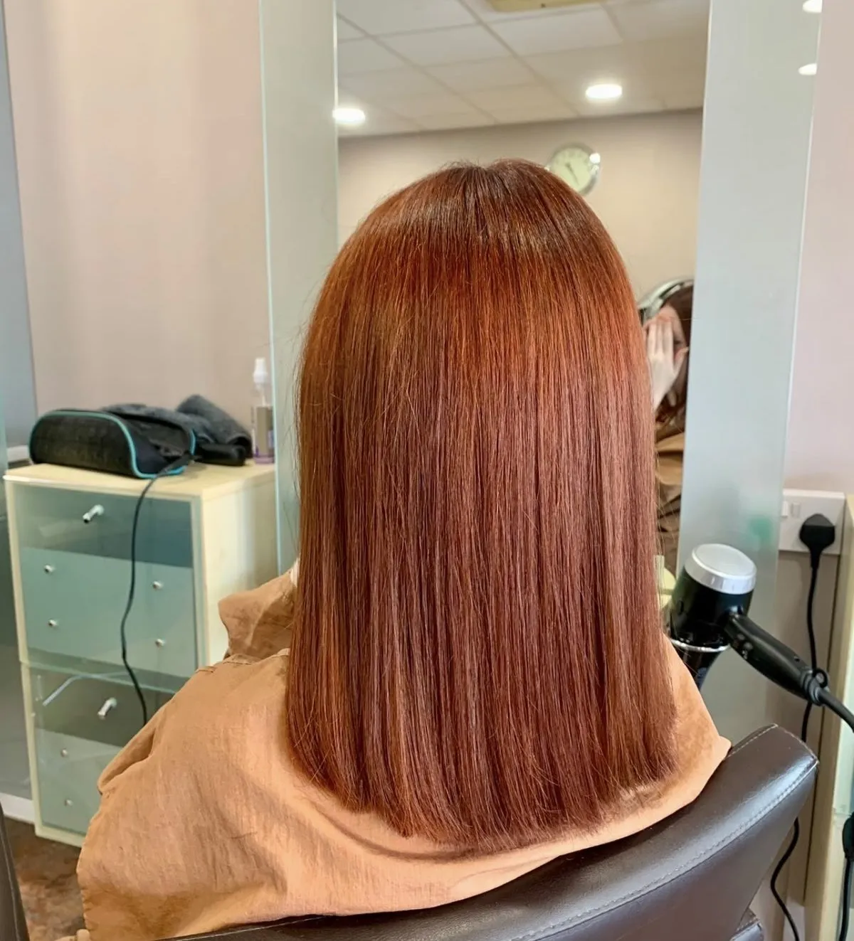 Vivid copper-red bob with a blunt finish